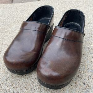 Classic Dansko Clogs.  Some scuffing and wear.  Please see pics. Size 39